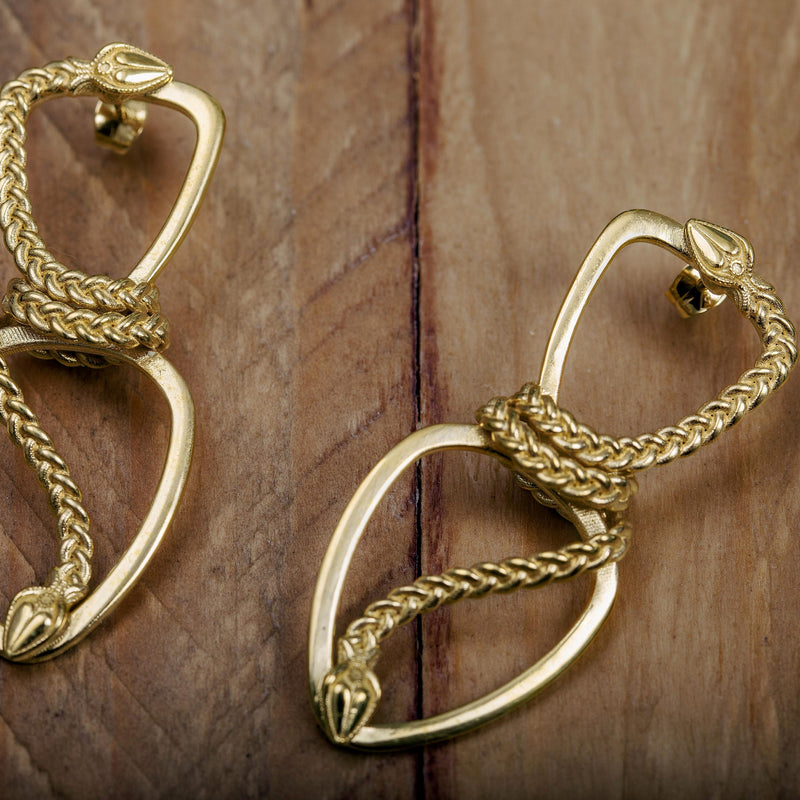 'Infinity earrings in recycled silver, gold plated, serpent design, the Wise One collection.’