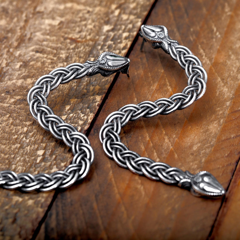 ‘Close-up of serpent earrings in recycled silver, the Wise One collection.’