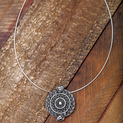‘Full view of serpent pendant in recycled silver, the Wise One collection.’