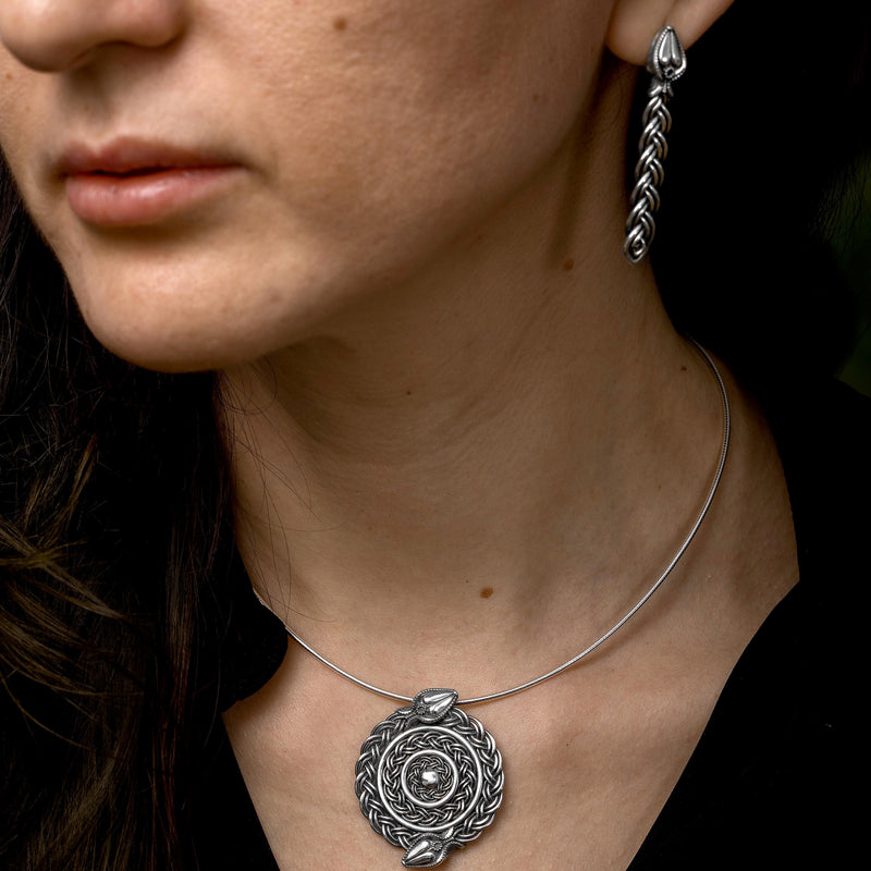 'Universe pendant in recycled silver, serpent design, the Wise One collection.’