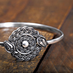 ‘Close-up of bangle in recycled silver, serpent design, the Wise One collection.’