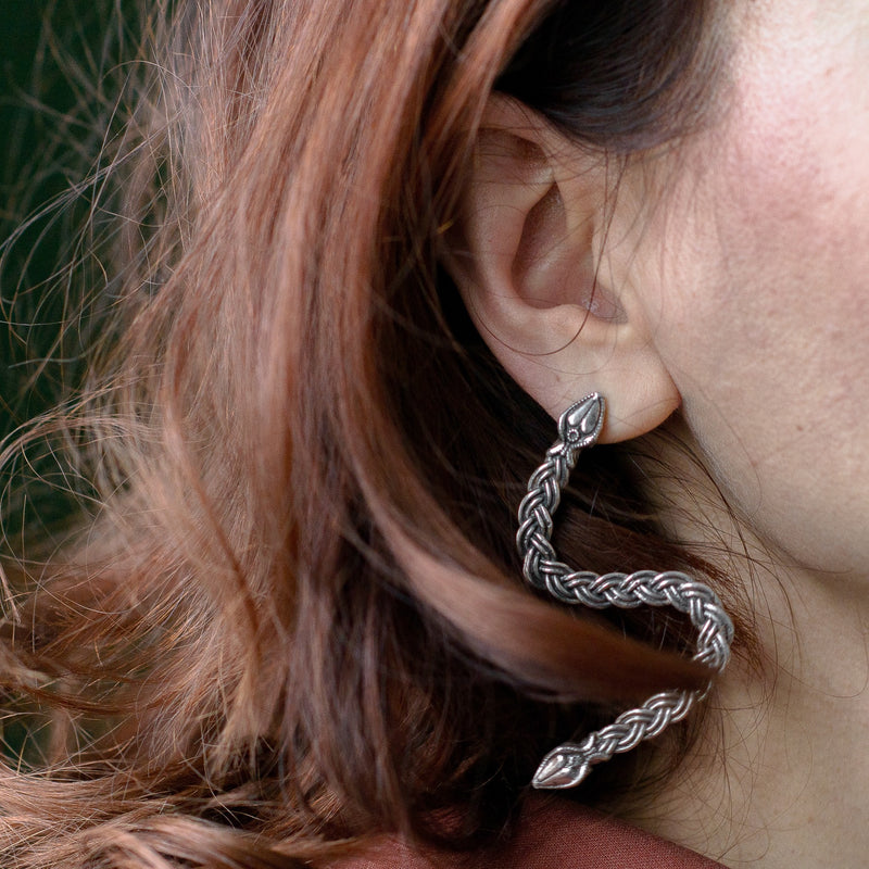 ‘ Ferunas serpent earrings in recycled silver, the Wise One collection.’
