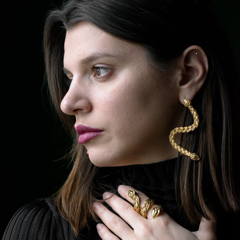 ‘Serpent earrings in recycled silver, gold plated, the Wise One collection.’