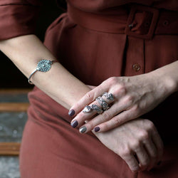 ‘Bangle in recycled silver, serpent design, the Wise One collection.’