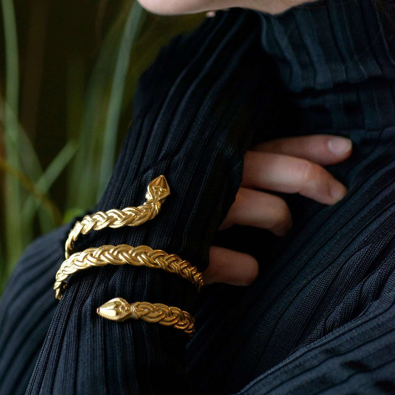 ‘Close-up of Ferunas cuff bracelet in Fairtrade gold, serpent design, the Wise One collection.’