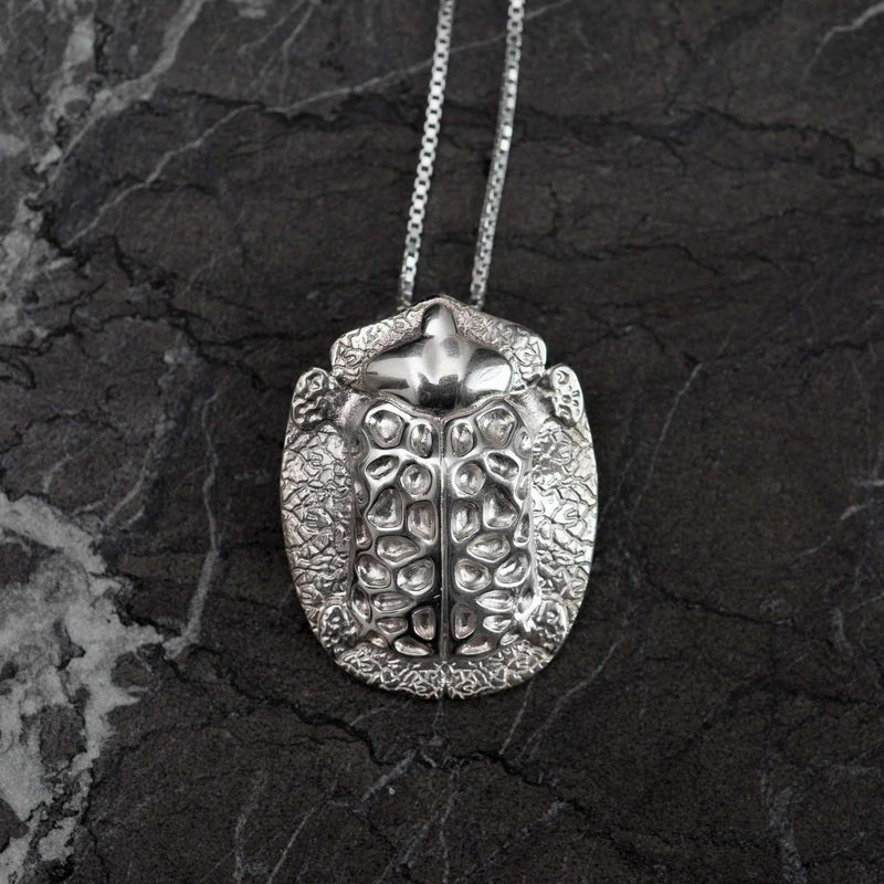 ‘Big pendant in recycled silver, the messenger collection, beetle design by Ferunas jewellery.’