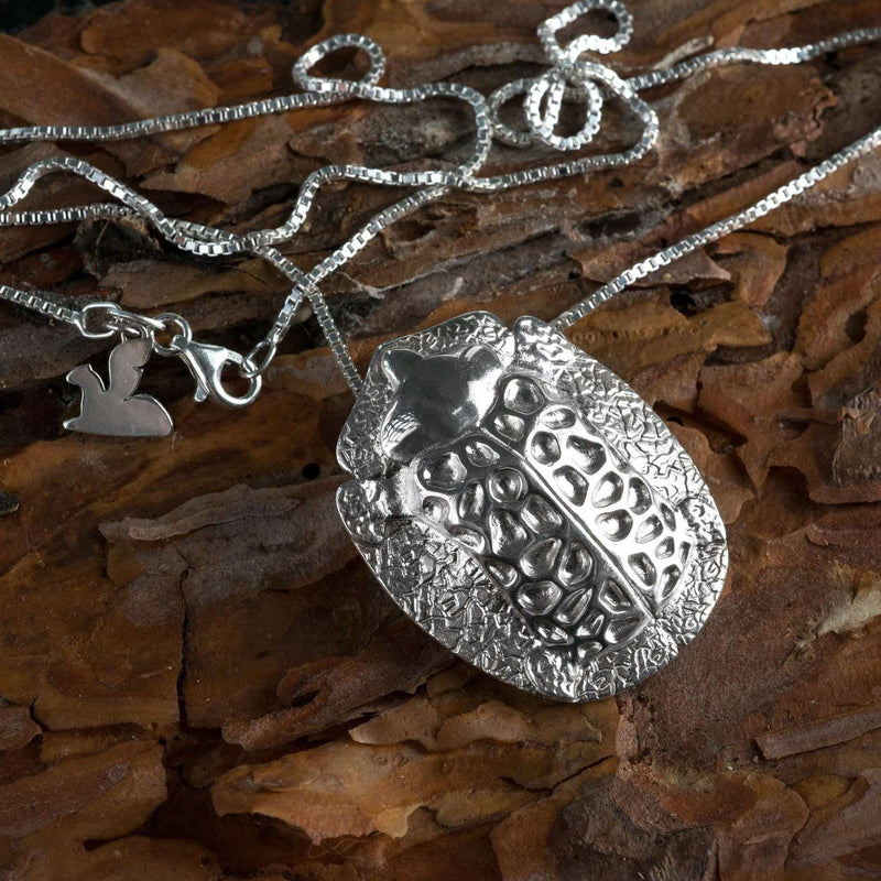 ‘ close-up of big pendant in recycled silver, the messenger collection, beetle design by Ferunas jewellery.’