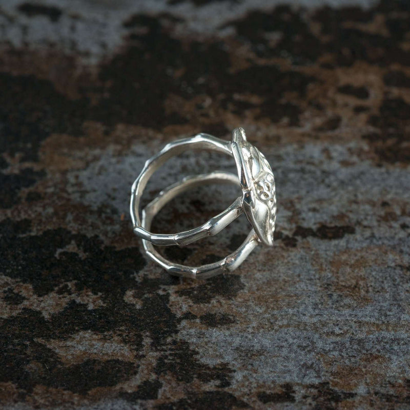 ‘Side view of ring in recycled silver, the messenger collection, beetle design.’